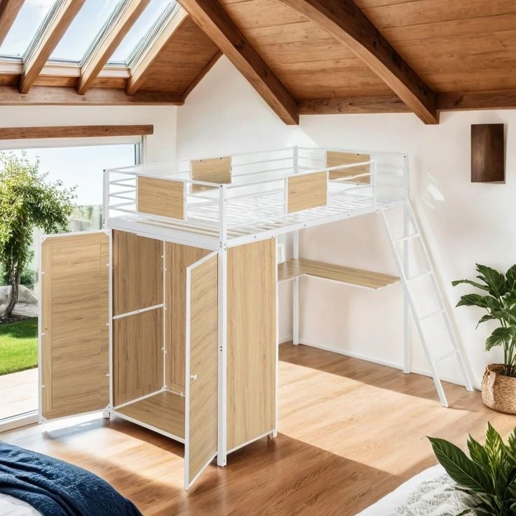 a loft bed with a desk underneath it in a room that has wood floors and white walls