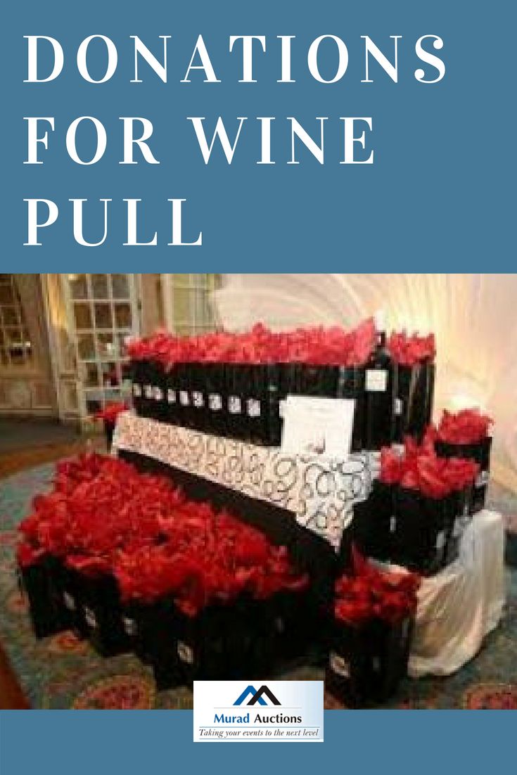 donations for wine pull are stacked on top of each other in black boxes with red roses