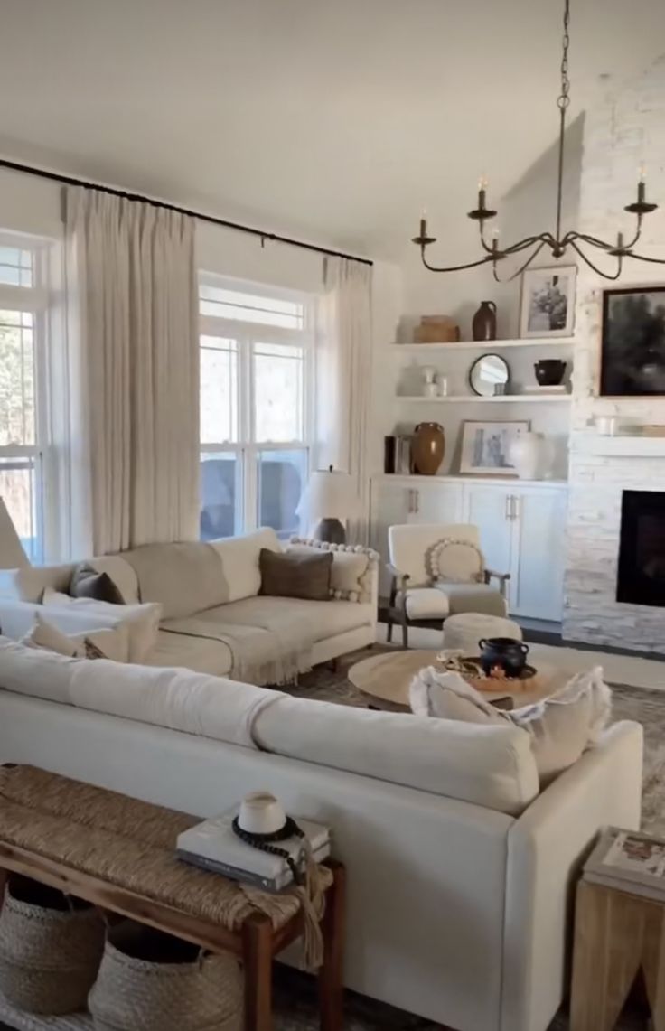 a living room filled with furniture and a fire place