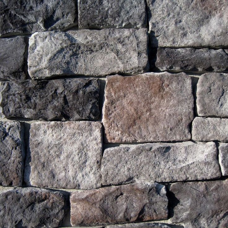 a stone wall is shown in grey tones