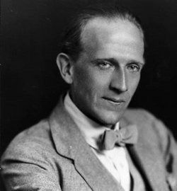 an old black and white photo of a man in a suit