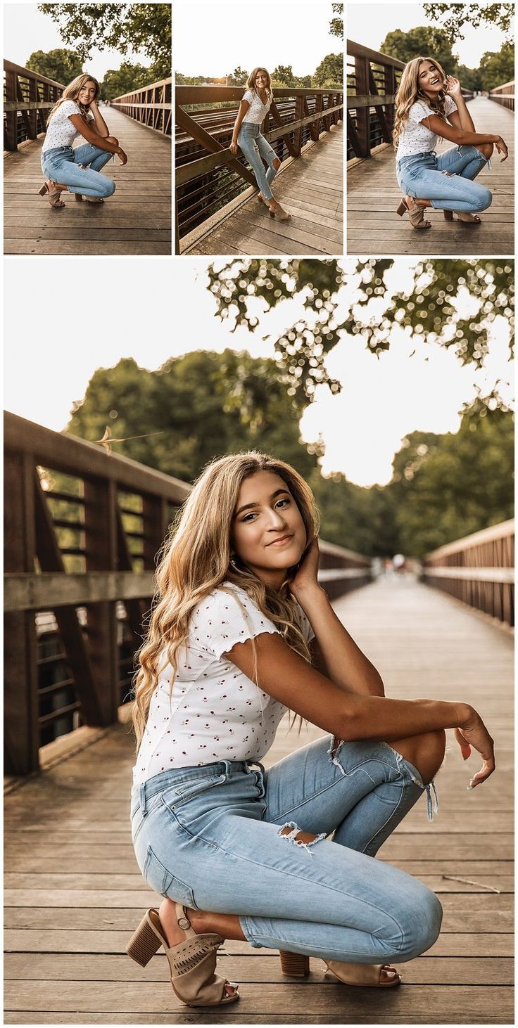 a woman sitting on top of a wooden floor next to a bridge and posing for the camera