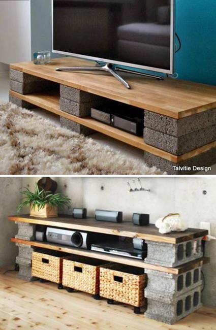 an entertainment center made out of stone and wood with baskets underneath it, next to a tv stand