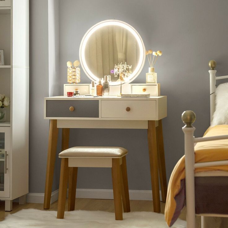 a bedroom scene with focus on the dressing table and stool, which also has a round mirror