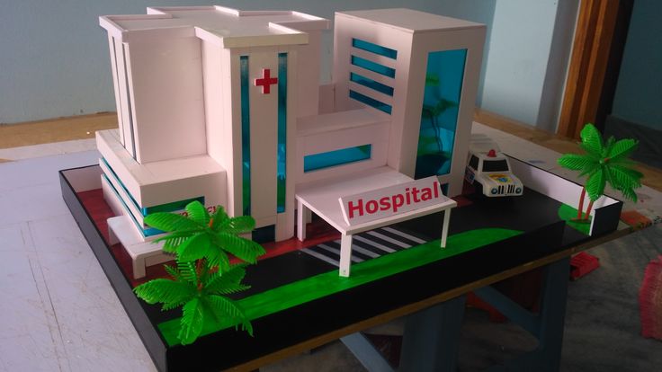 a model of a hospital with palm trees