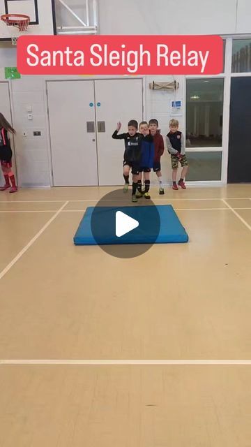 a group of children standing on top of a basketball court