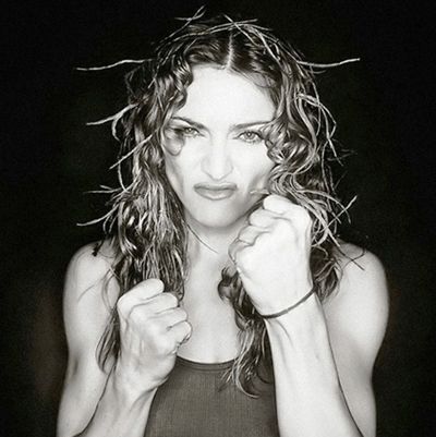 a black and white photo of a woman with wet hair