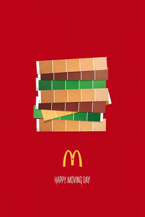 a mcdonald's happy moving day poster with a large stack of hamburgers on it