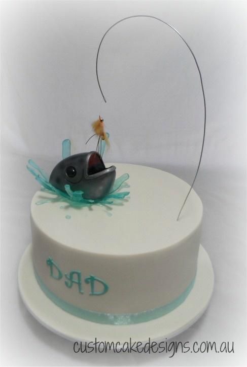 a birthday cake with a fish on top