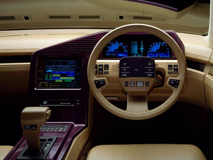 the interior of a luxury car with dashboard and electronic devices on it's display screen