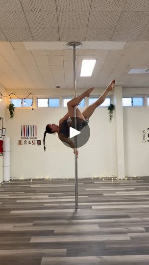 a person on a pole in an empty room