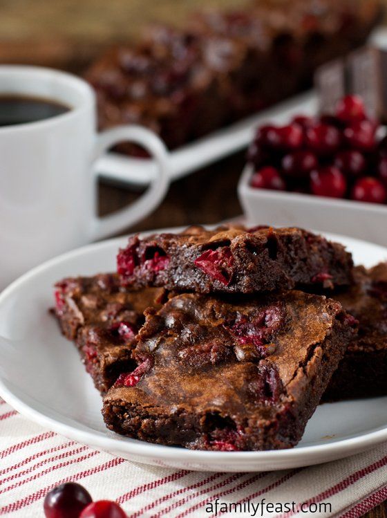 chocolate cranberry brownies on a white plate