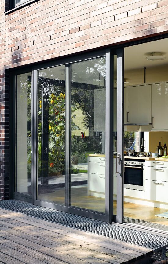 an open patio with sliding glass doors leading into the kitchen