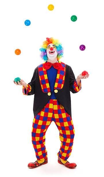 a clown is juggling with balls in his hands