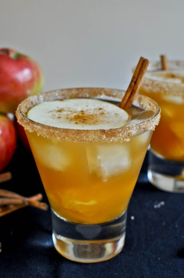 two glasses filled with an apple cider cocktail