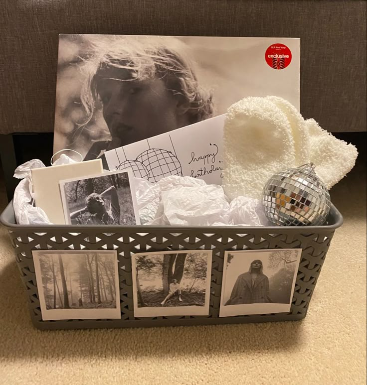 a basket filled with pictures and other items