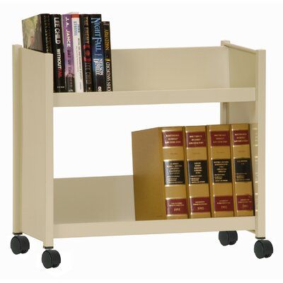 a book shelf with several books on it and some black wheels in front of it