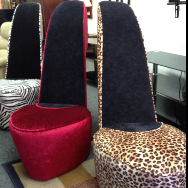 several different colored chairs with leopard print on them