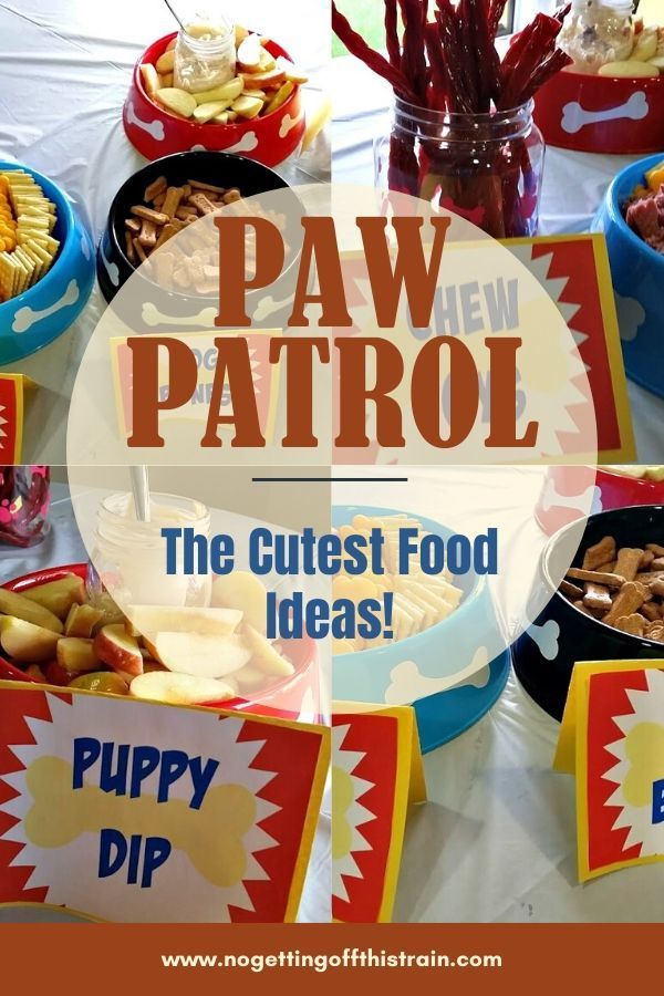 a table topped with bowls filled with food next to a sign that says paw patrol