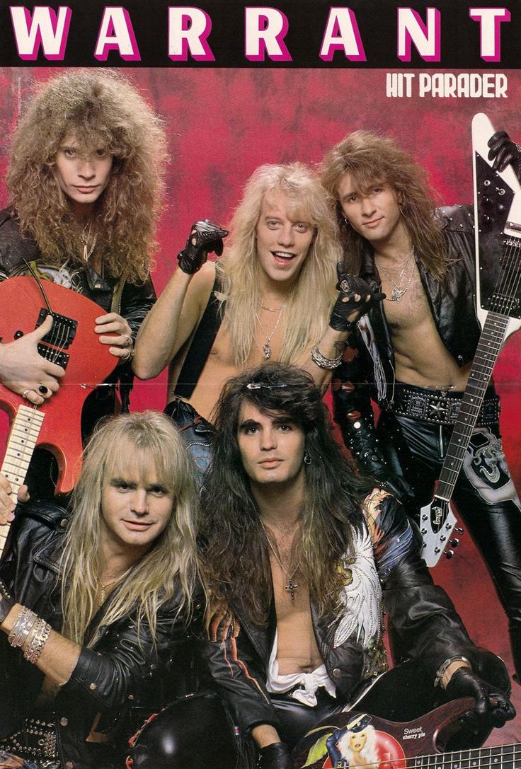 the band warrant posing with their guitars