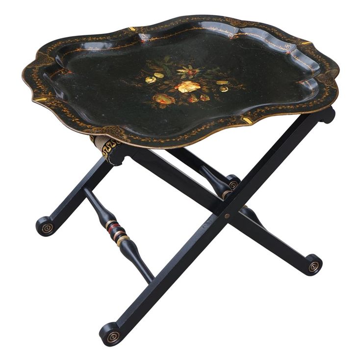 a black tray with gold flowers on it