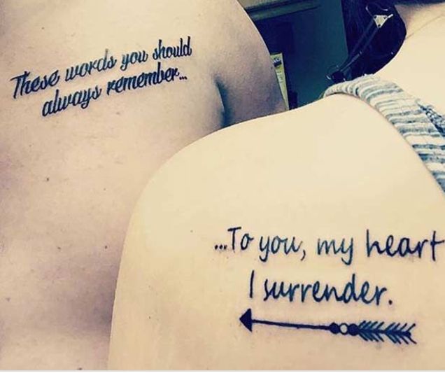 two people with tattoos on their backs saying to you, my heart i'm under