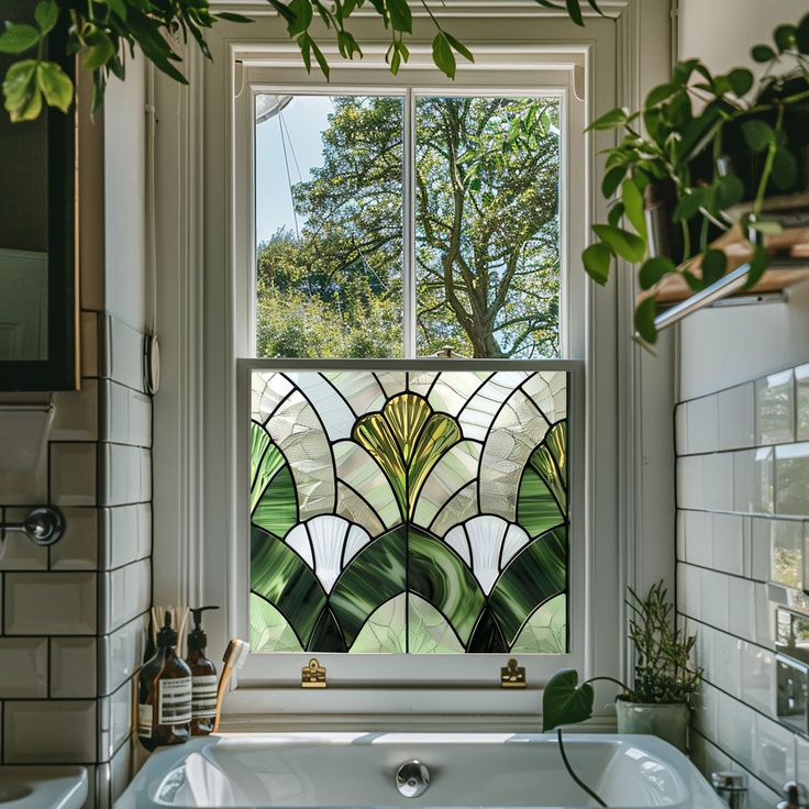 a bath tub sitting under a stained glass window