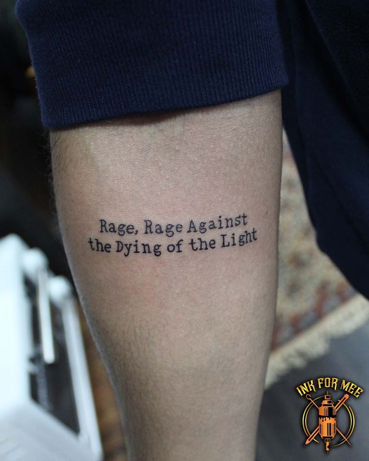 a person with a tattoo on their leg that says race, rage against the dying of the light