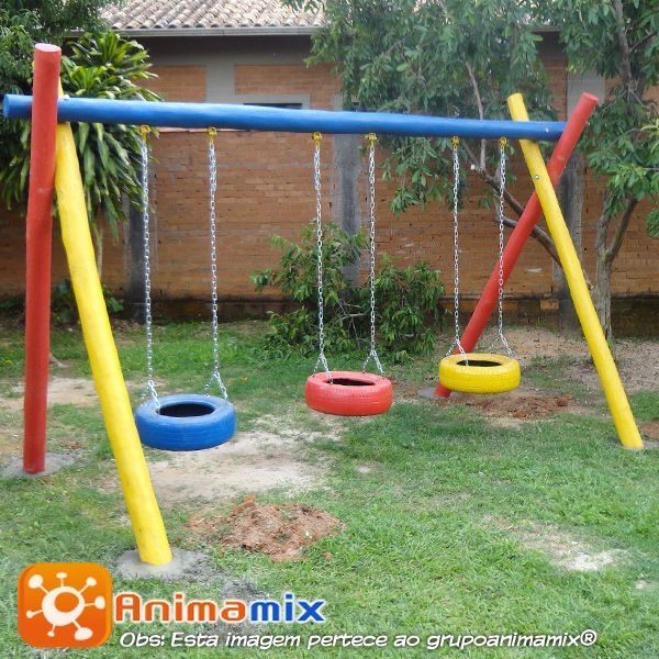 an outdoor play area with swings and toys