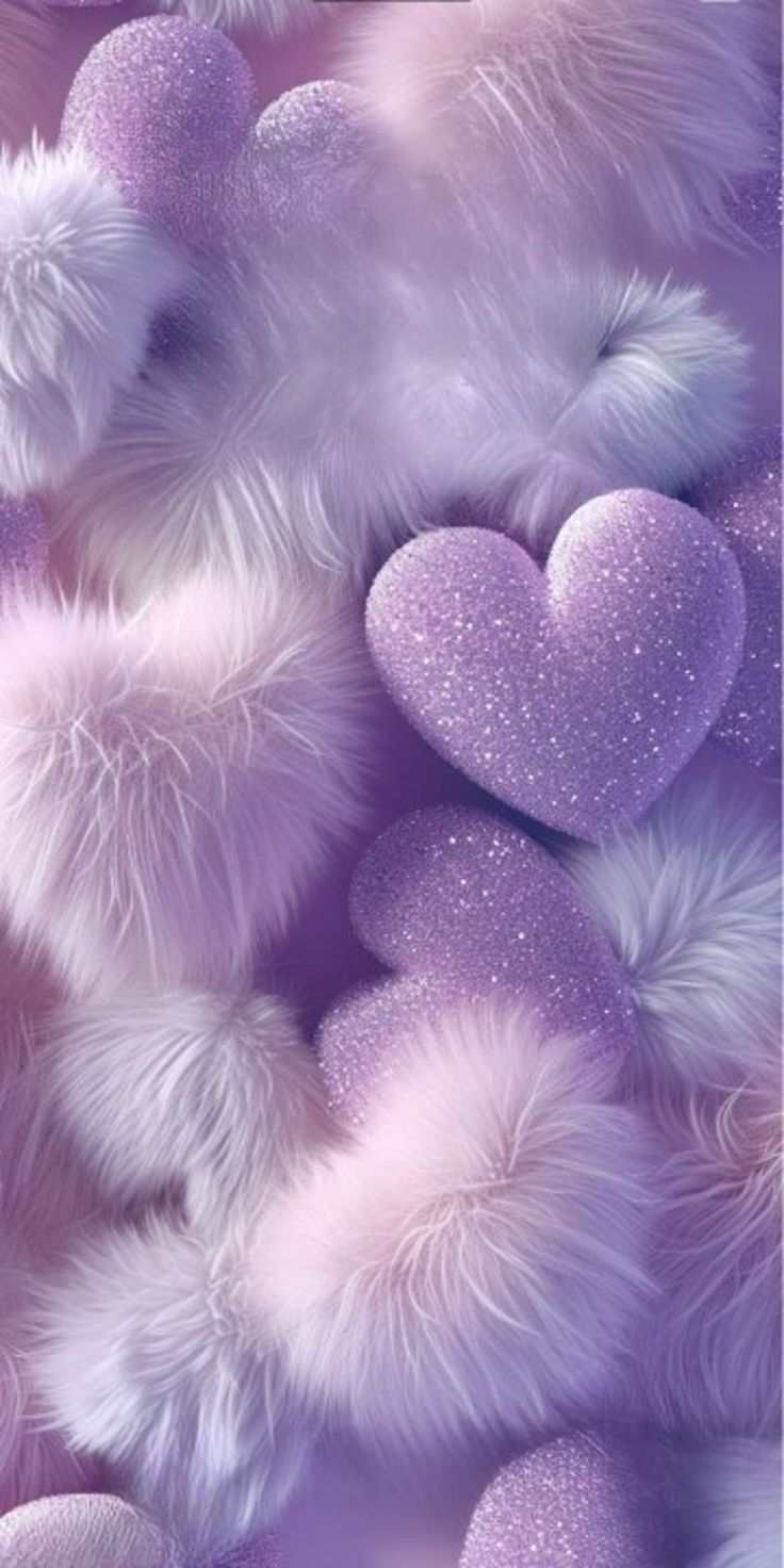 purple and white teddy bears with hearts in the middle, on a background that is blurry