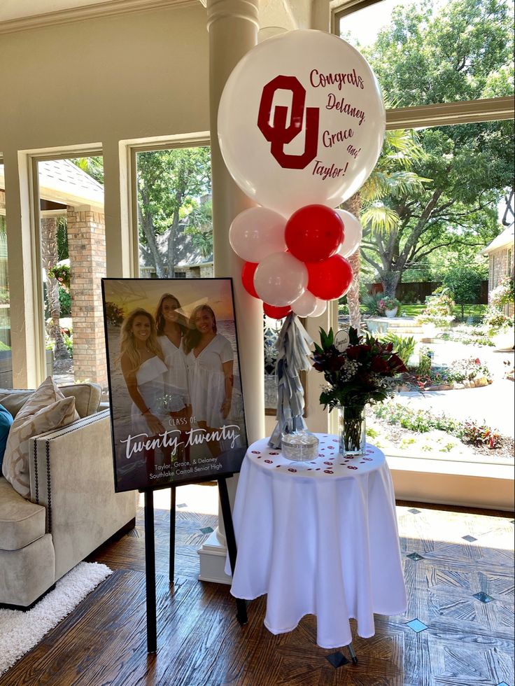 balloons are on display in front of a table with a sign that says, congratulations dinner for