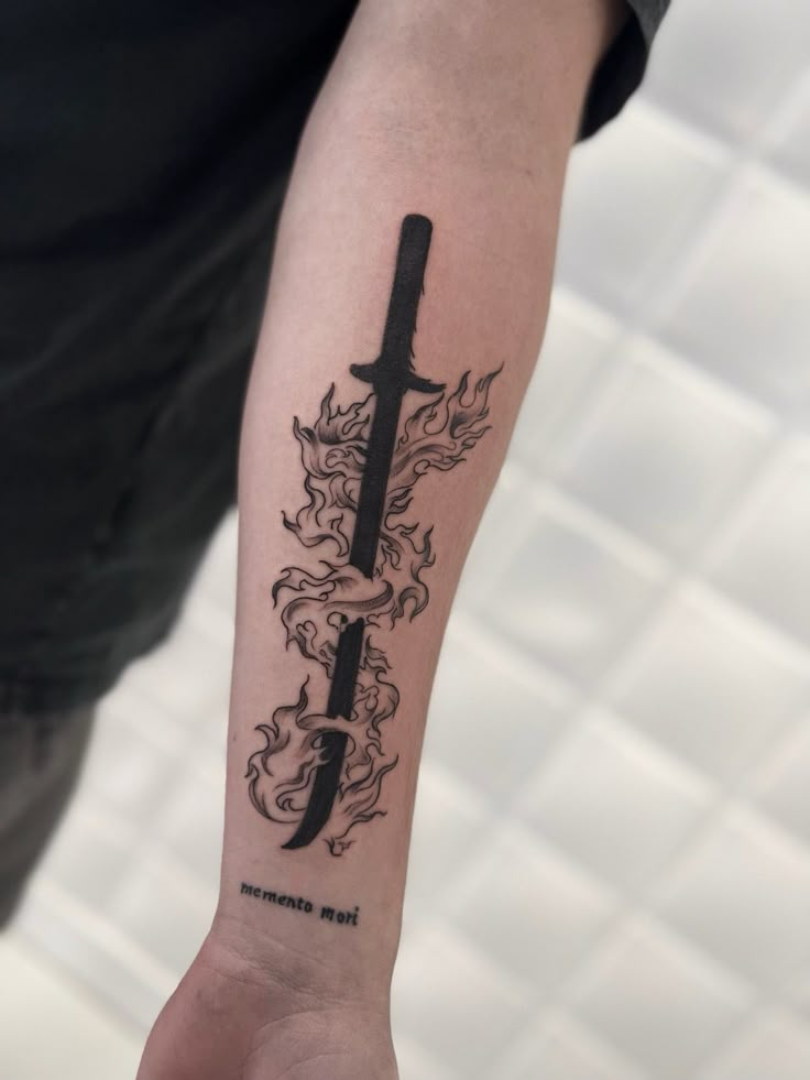 a person with a tattoo on their arm holding a knife in one hand and an arrow in the other