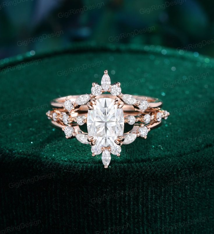 a diamond ring on top of a green velvet covered cushion with diamonds in the center