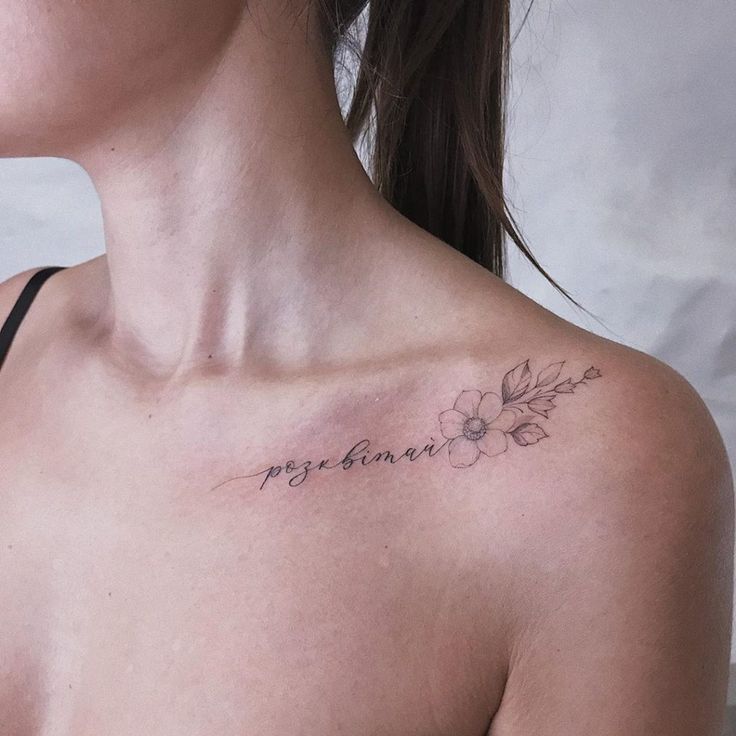 a woman with a small tattoo on her chest