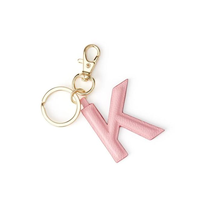 a pink keychain with the letter k on it's front and back ends