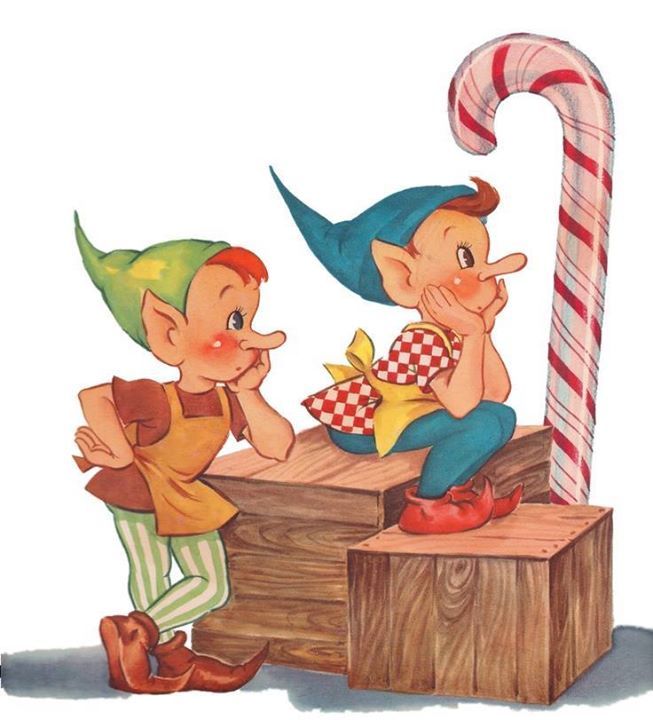 two little elves sitting on a wooden box next to a candy cane