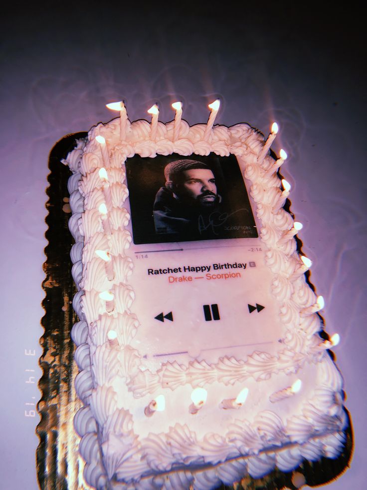 a birthday cake with an album on it