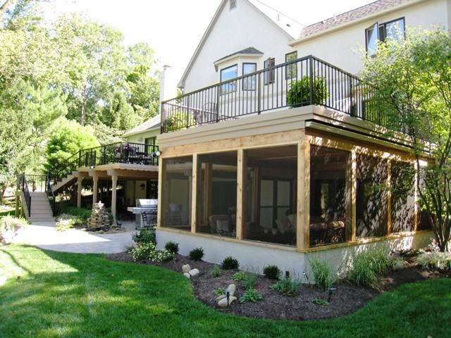 a house with a covered patio in the front yard