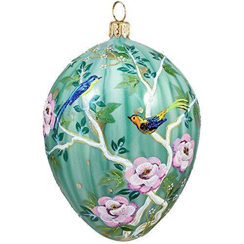 a glass ornament with birds and flowers painted on it