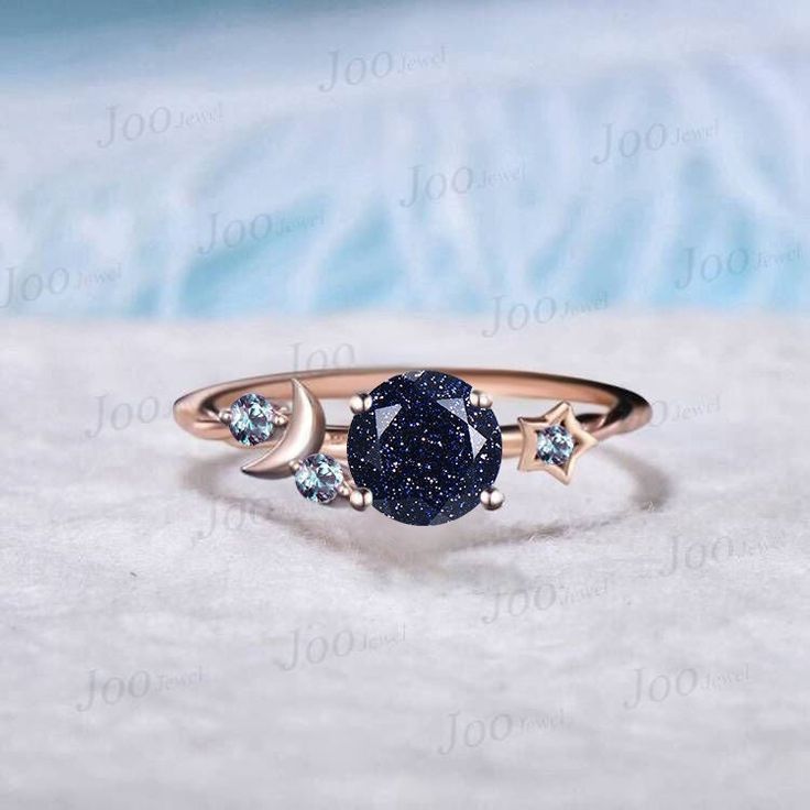 I LOVE YOU TO THE MOON BACK RING 1ct Round Cut Galaxy Starry Night Blue Goldstone Ring Cluster Alexandrite Wedding Ring Moon Star Design Unique Promise Ring Birthday Gifts Accept engrave the words inside the ring service: https://www.etsy.com/listing/1103764936/engrave-service HEALING RING : Blue Sandstone (also known as Blue Goldstone) symbolizes enterprise, success, victory, and glory, which enhance one's leadership and entrepreneurial skills. It is an excellent stone to meditate with before giving a speech or starting a new project. It is also very good at calming the senses and cleansing the chakras on all levels. Blue Sandstone bridges the gap between the earthly and spirit realms, so it is a great stone to use for contacting spirit guides or performing holistic healing. Blue Sandston Blue And Black Ring, Night Sky Jewelry, Space Themed Engagement Ring, Moon Promise Ring, Galaxy Ring Engagement, Starry Engagement Ring, Moon Ring Design, Starry Night Ring, Celestial Promise Crystal Ring