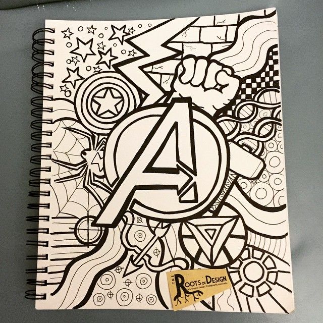 a spiral notebook with the letter a on it and doodled artwork in black and white