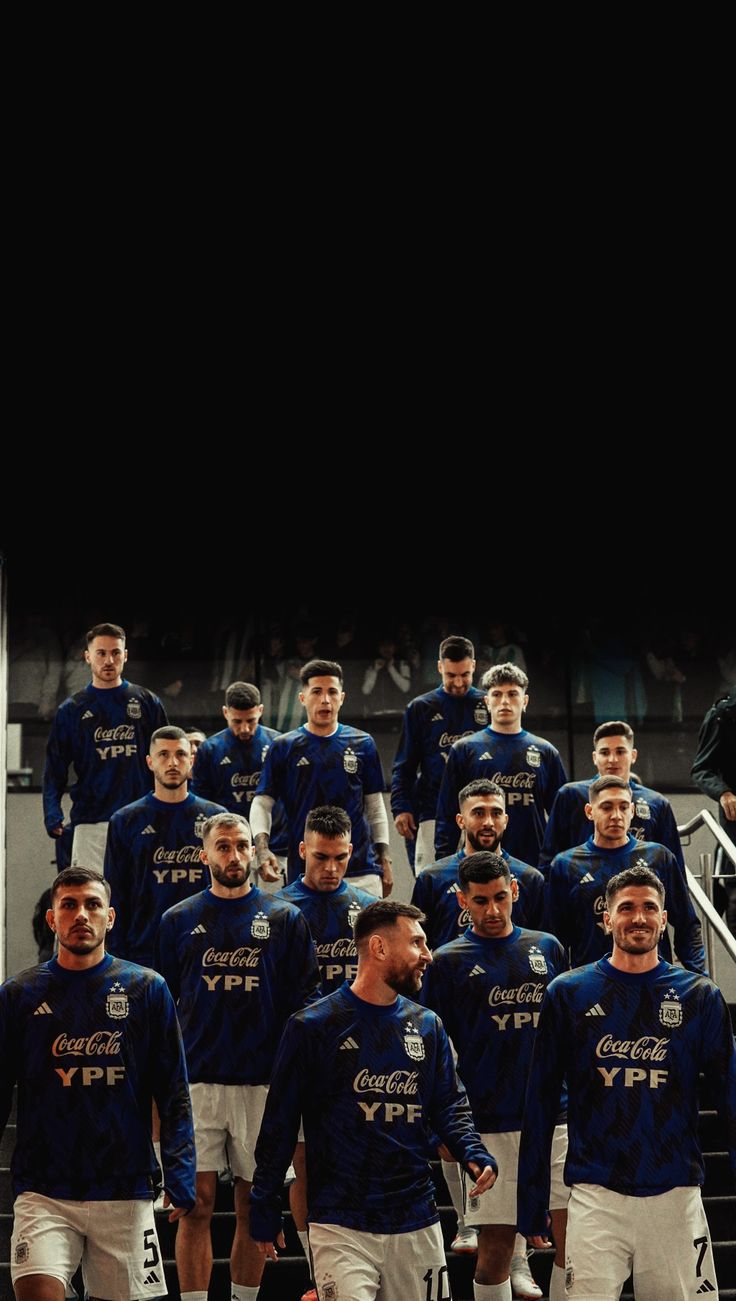 the soccer team is posing for a group photo in front of their dugout stairs