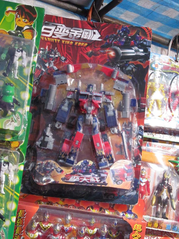 several toy action figures are on display for sale