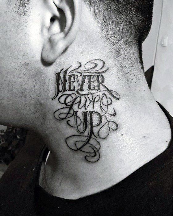 a man's neck with the words never give up tattooed on his upper part