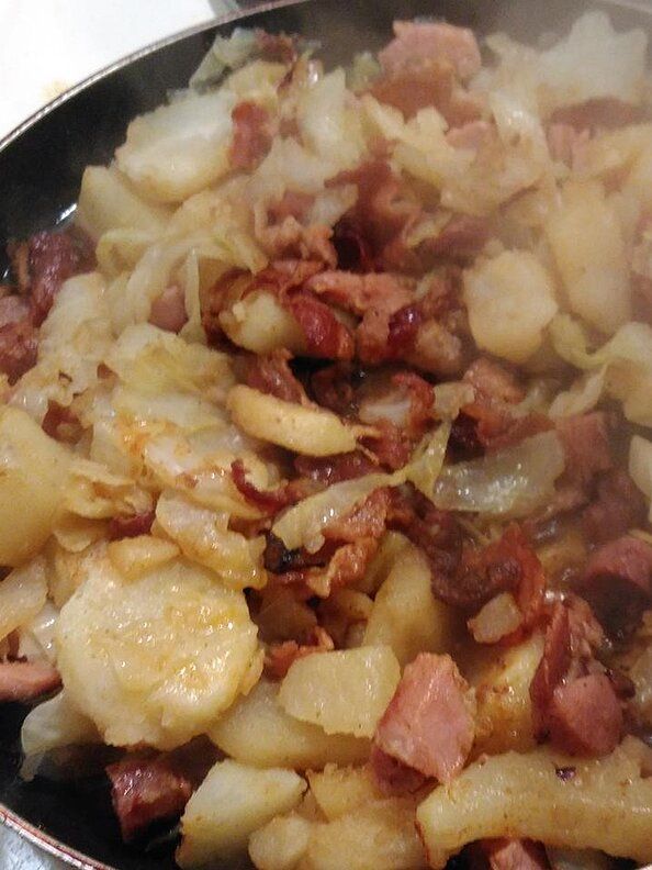 the food is being cooked in the pan on the stove top, and ready to be eaten