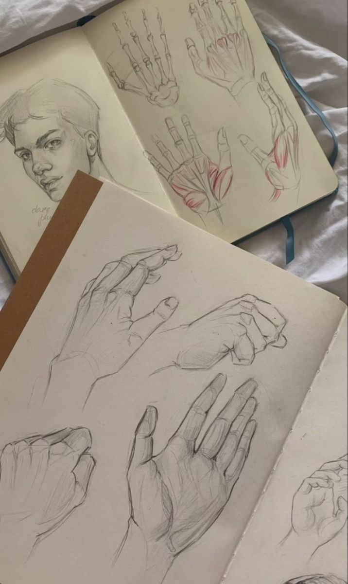 three drawings of hands are shown on a sheet