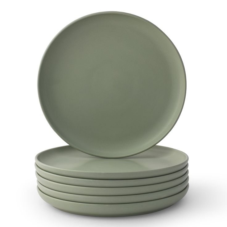 a stack of green plates sitting on top of each other