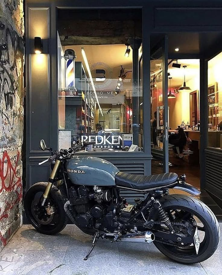 a motorcycle parked in front of a store