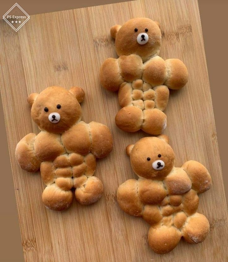 four teddy bears made out of bread on a cutting board