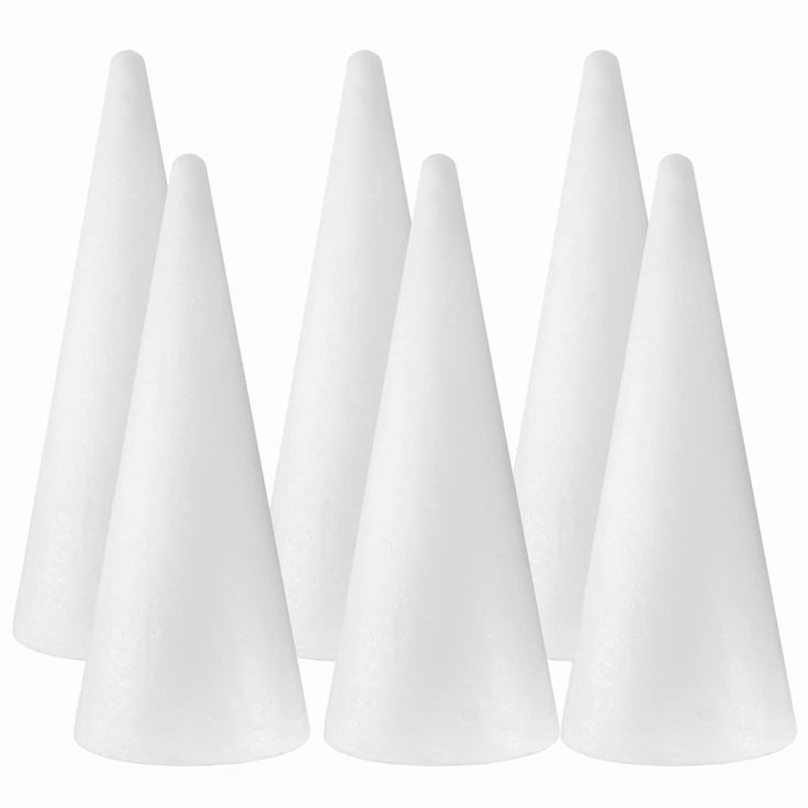 five white cones are lined up in a row on a white background, with one cone facing the camera